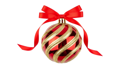 A festive red and gold christmas ornament decorated with a red ribbon bow, isolated on a black background