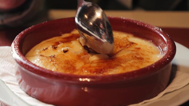 Typical dessert of Catalan cuisine, Crema catalana. Consists of a custard made from egg yolks, usually topped with a layer of caramelized sugar for a crunchy contrast. Traditionally enjoyed on St