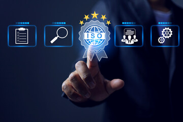 ISO certification concept with businessman pointing on international standardization five star certified mark to implement compliance standards requirement industrial factory integration management