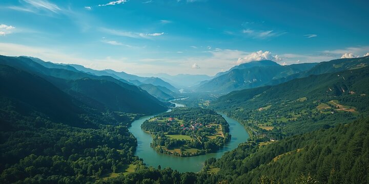Summer landscape featuring water, sky, and lush forest from an aerial perspective, highlighting nature preservation