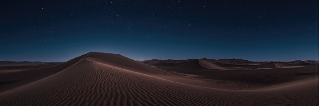 Nighttime desert sand dunes, highlighting seasonal changes in surface textures and shadows