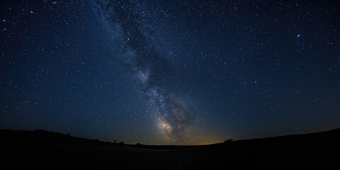 Obraz premium Night sky with the Milky Way's bright band and stars, ideal for astronomy background use