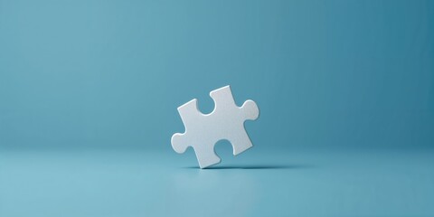 Close-up of a white jigsaw puzzle piece on a blue background, assembly accuracy, World Puzzle Day