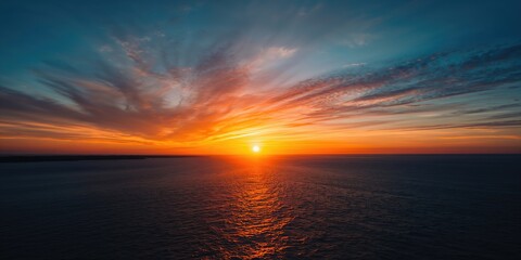 Fototapeta premium Dramatic golden sunset over the sea with reflection, seasonal change and natural light in summer