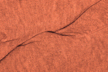 Fondo de lana naranja de un jersey arrugado