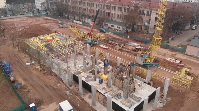 aerial view of the construction site. The foundation, the foundation of the building, the construction of walls, monolithic work, reinforcement.