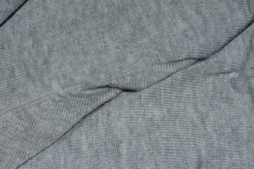 Fondo de lana gris de un jersey arrugado

