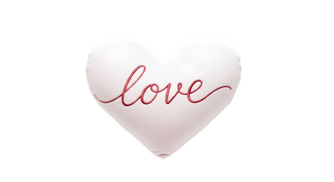 White heart shaped pillow with the word love embroidered in delicate pink script