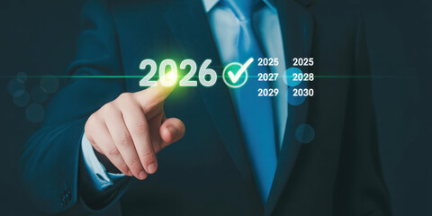 Businessman selecting 2026 from virtual timeline