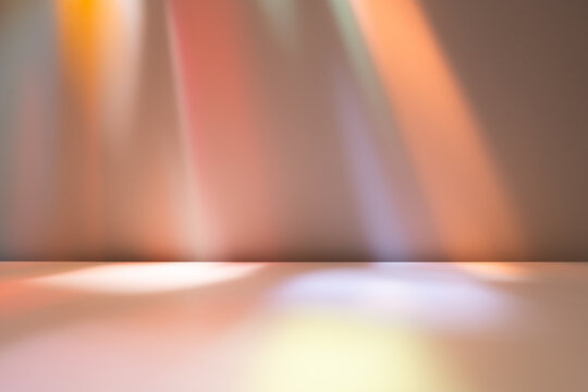 Stained glass lighting on wall and floor. Background with smooth abstract light reflections on wall. Mockup for presentation, branding products, cosmetics food.