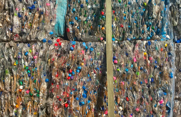 Plastic water bottles have been baled for recycling