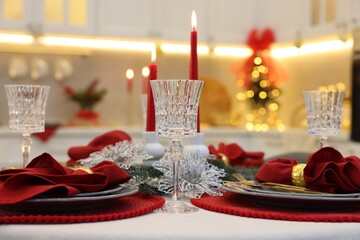 Festive table setting with Christmas decor in kitchen, closeup