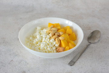 Healthy Cottage Cheese Bowl with diced Mango and Cashews