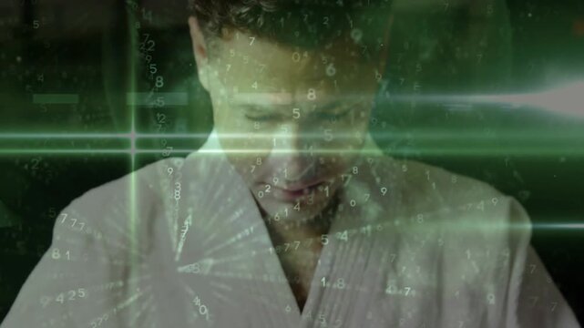 Man bowing, clasping hands, green HUD sweeping across upper body, causing chin raising for dojo