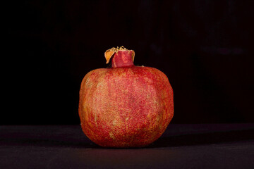 pomegranate on black background