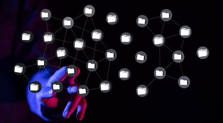 Hand touching network of connected data folders, representing data management, storage, cloud...