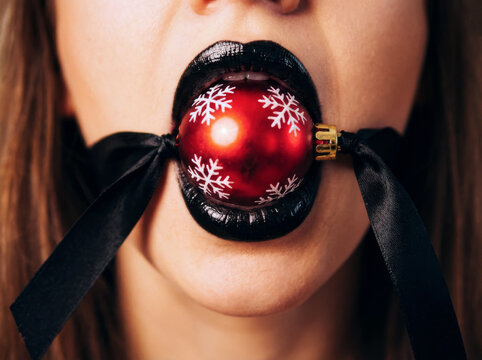 New Year's ball gag on black silk ties