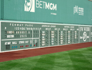 Fototapeta premium Boston, MA - USA - 08-06-2025: The scoreboard and green monster left field wall at Fenway Park, home of the Boston Red Sox Major League Baseball team