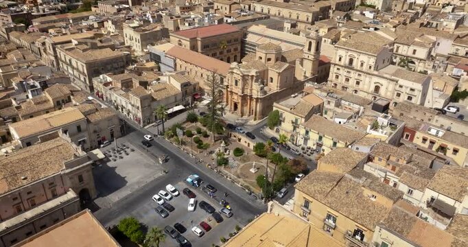Aerial view of San Domenico church located in Piazza XVI Maggio in the historic center of Noto, in province of Syracuse, Sicily, Italy. It's a Baroque-style and Roman Catholic church. Sunny summer day