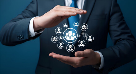 Businessman protecting and supporting a group of people icons representing teamwork community and social connections in a professional setting with a dark blue background