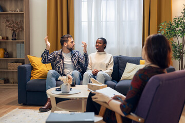Diverse couple discussing issues during psychotherapy session