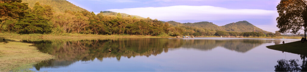 A panoramic view of a river and mountains.