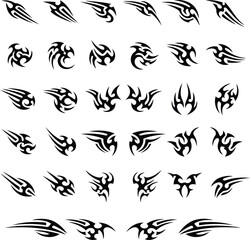 Fototapeta premium Tribal tattoo symbols set with abstract flame designs, vector decorative shapes, and bold black motifs