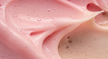 Close up of smooth pink cosmetic cream with bubbles and folds on surface