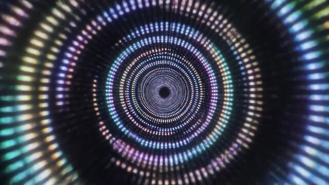 Abstract tunnel of colorful glowing light dots creating an infinite vortex motion effect in dark space