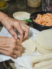 Hands of a woman making a traditional dish in México called 