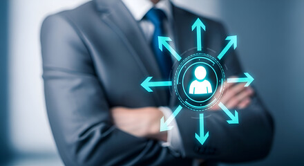 Businessman in gray suit with blue tie standing with arms crossed, futuristic digital icon of a person surrounded by arrows overlayed on his chest