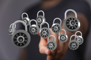Visualize digital security with hand interacting with floating combination locks, representing safety, protecti