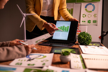 Businesswomen discussing esg strategy with chart data