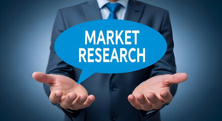 Businessman in suit holding speech bubble with market research text, concept of business analysis and data collection for informed decision making