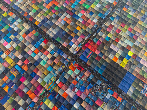 Aerial view of a vibrant patchwork of colorful tents creates a mesmerizing geometric tapestry, Dhaka, Dhaka Division, Bangladesh.