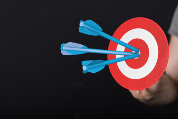 Arrows striking the bullseye, representing goals met. Success, achievement, focus, targeting, and...