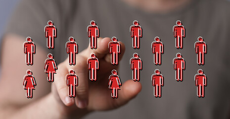 Abstract image showing a hand pointing at a network of digital human figures, representing teamwork, communication, and connectivity.