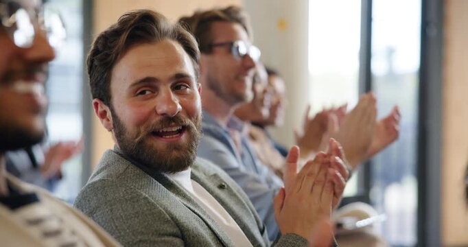 Applause, business and crowd with happy man in conference room for seminar or workshop. Audience, development and smile with corporate employee people clapping in auditorium for presentation success