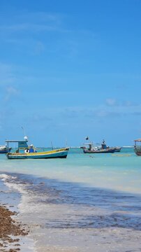 Fishing boats at Sao Jose da Coroa Grande beach, Pernambuco.