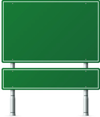 Blank green highway signs showing path choice direction