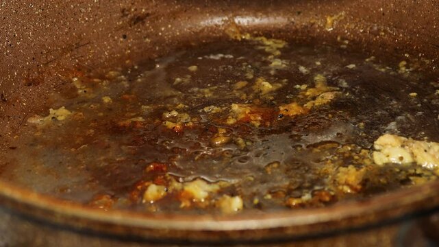 frying pan with frozen old oil and fat on the bottom