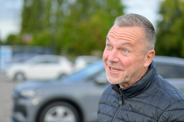 Mature Man Talking Expressively Outdoors