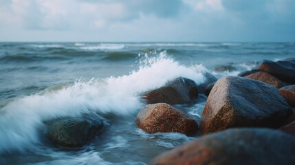 The ocean is rough and the waves are crashing against the rocks