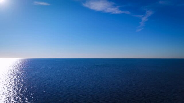 Aerial view of blue ocean and blue sky suring morning sunrise