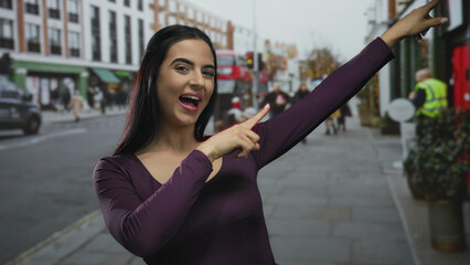 Fototapeta premium Woman pointing excitedly outdoors on a bustling city street with vibrant energy, showing landmarks and engaging with the urban environment around her.