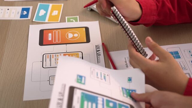 Panorama video of startup company employee planning on user interface prototype for mobile application or website in office. UX UI designer brainstorm designing user friendly interface plan. Synergic