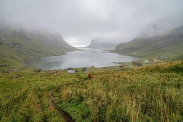 Hiker on the way from Bunes beach to Vindstad