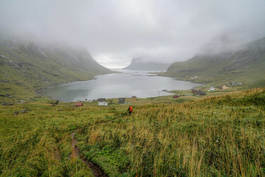 Hiker on the way from Bunes beach to Vindstad