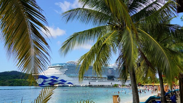 Roatan Honduras Dec 1, 2025 The Star Princess cruise ship is docked at Mahogany Bay Beach and cruise centre and travellers enjoying the warm tropical weather