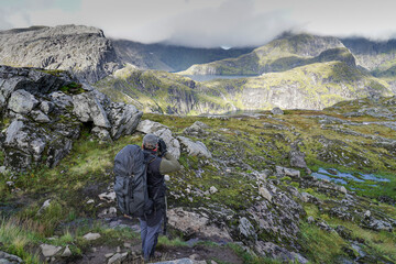 Fototapeta premium hiker on munkebu trail in lofoten